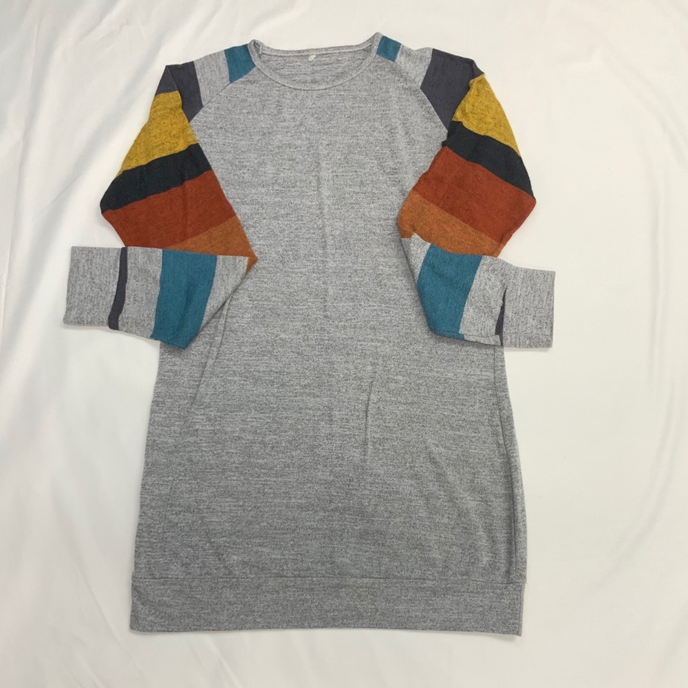 Gray sweater with blue,orange, and yellow sleeves